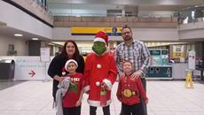 Grinch and family in front of Concourse C