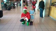 Grinch with happy little girl 